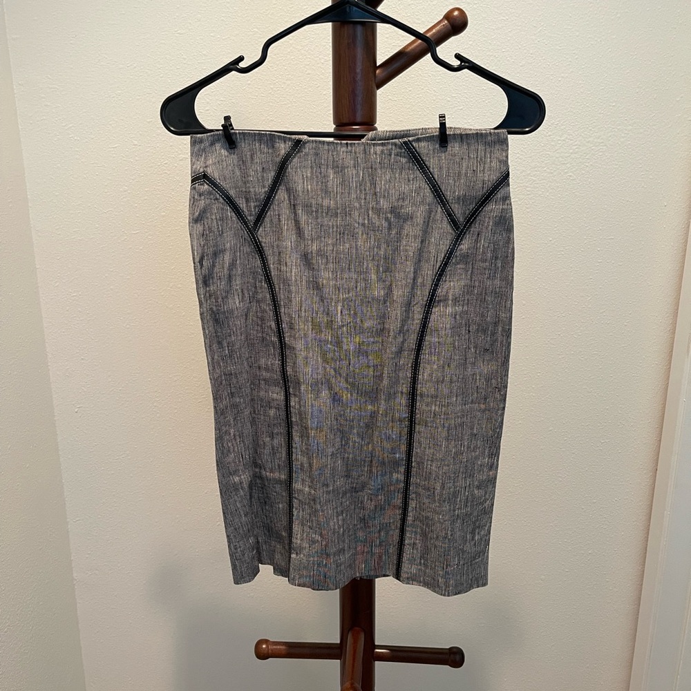 Bebe skirt with leather accents. Size 4. Good condition.
